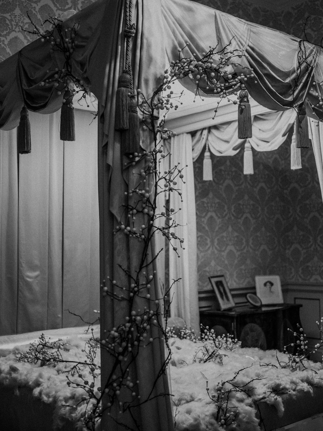 grayscale photography of flower in bedroom area