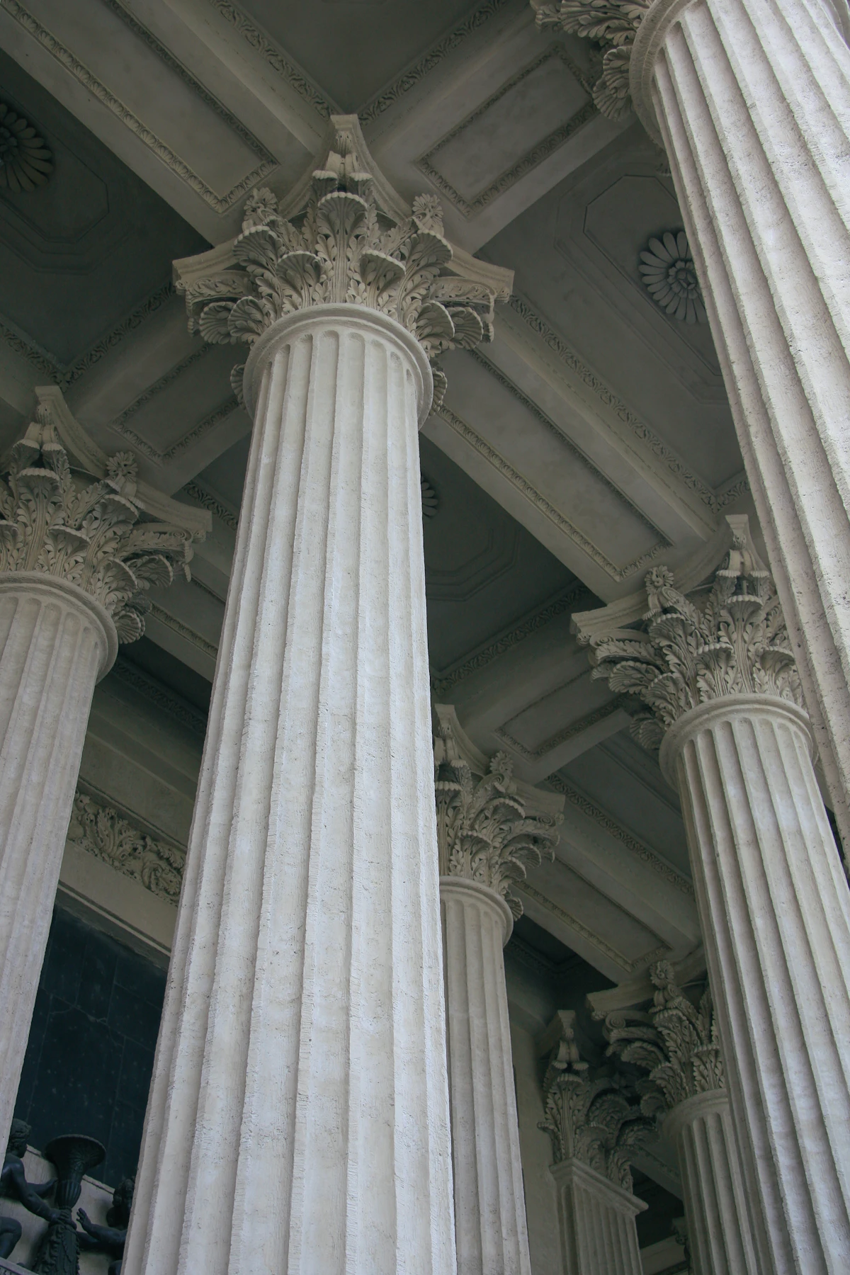 Towering classical stone columns in a monumental cathedral interior.