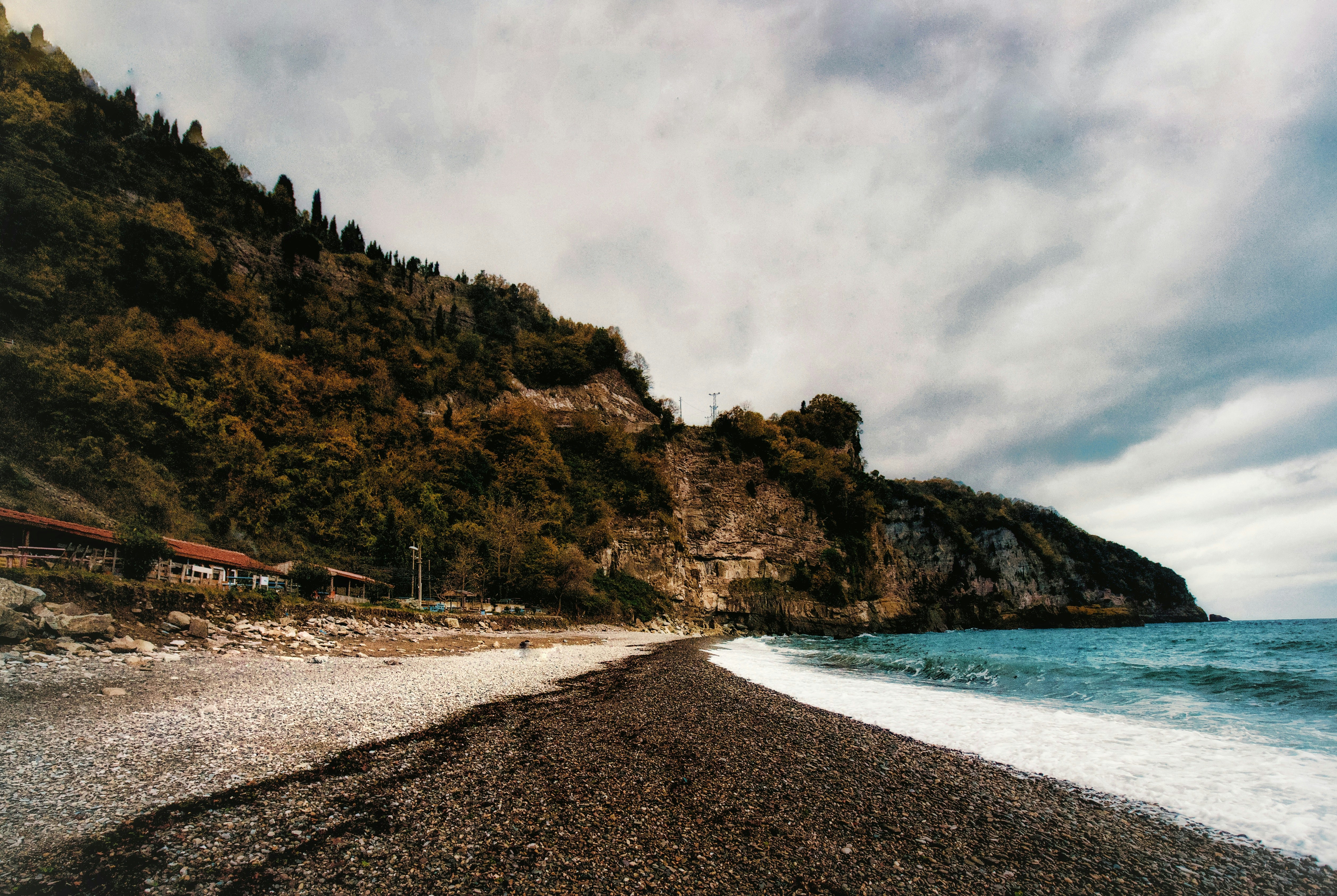 seashore under cloudy sky, Rocky Shore in cloudy day</p><p>