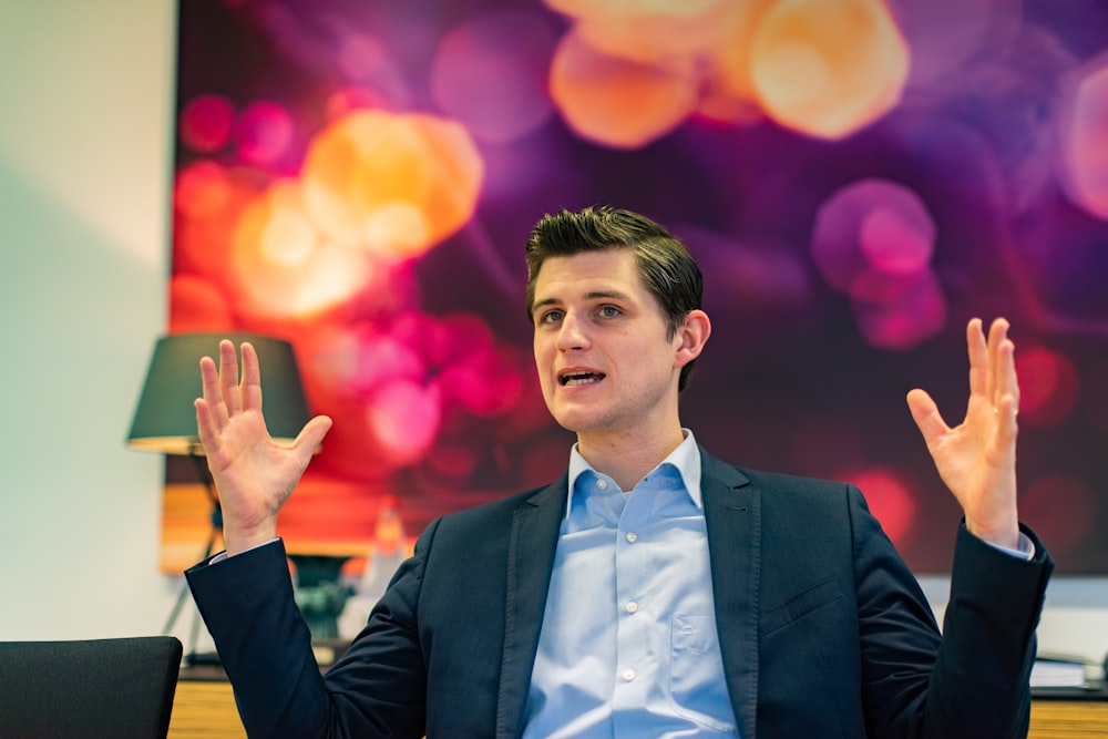 selective focus photography of man in black blazer