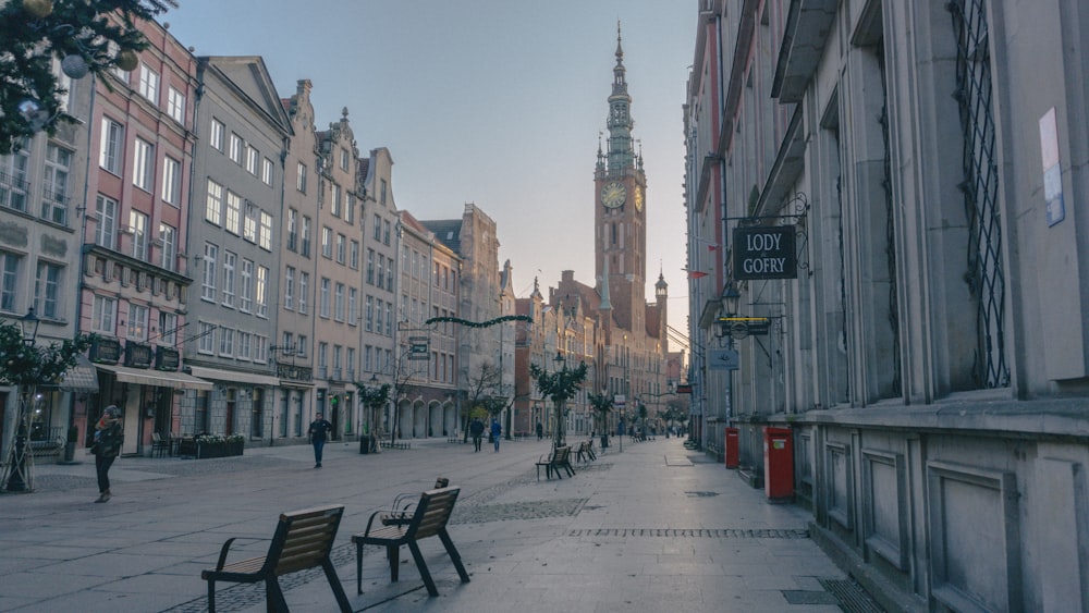 empty walkway by buildings during daytime