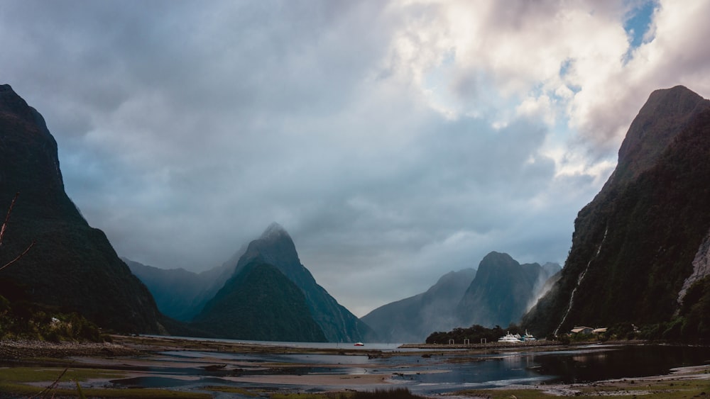 mountains near body of water at daytime