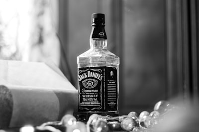 jack daniel's tennessee whisky bottle near window glamorous google meet background