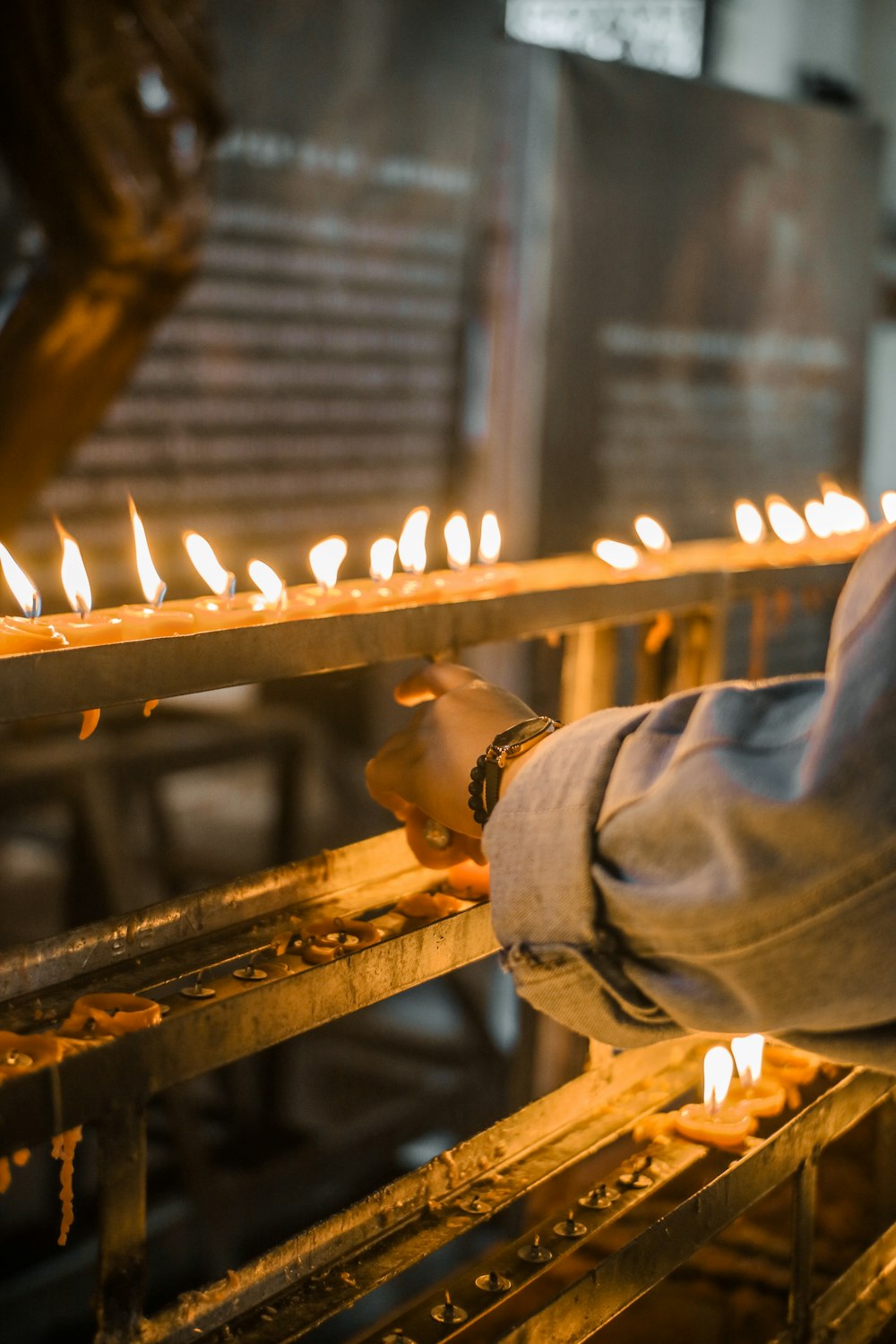 candles lighted on rack