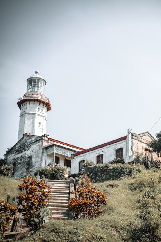 white concrete castle in Cape Bojeador Lighthouse Philippines