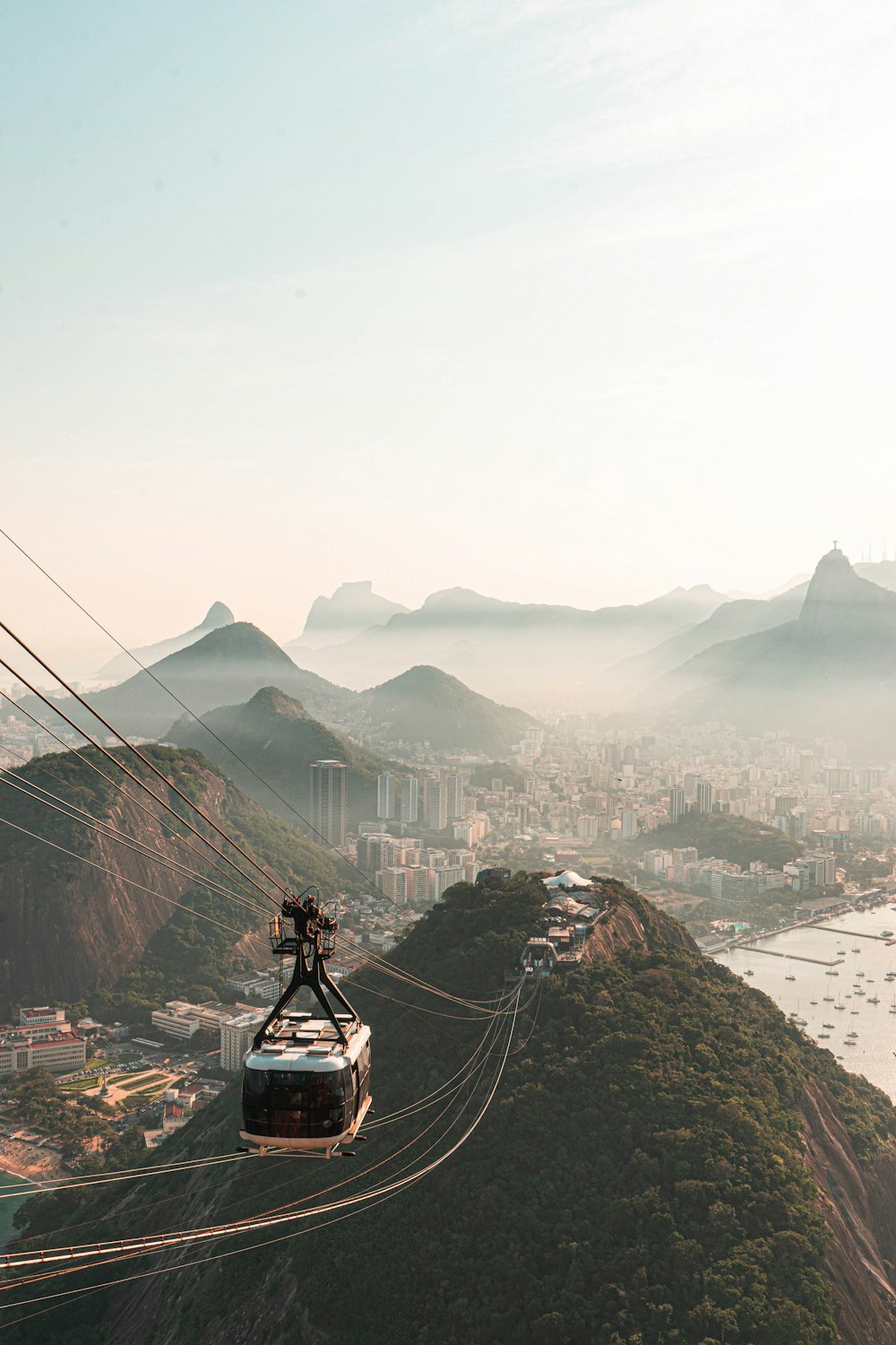 white cable cars on mountain