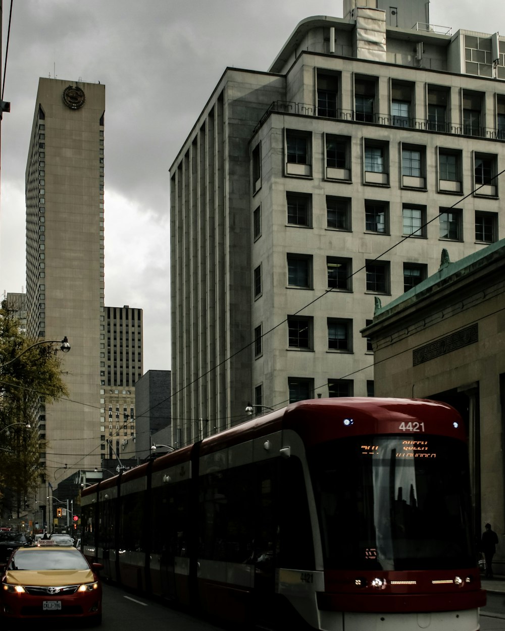 red and white train near building