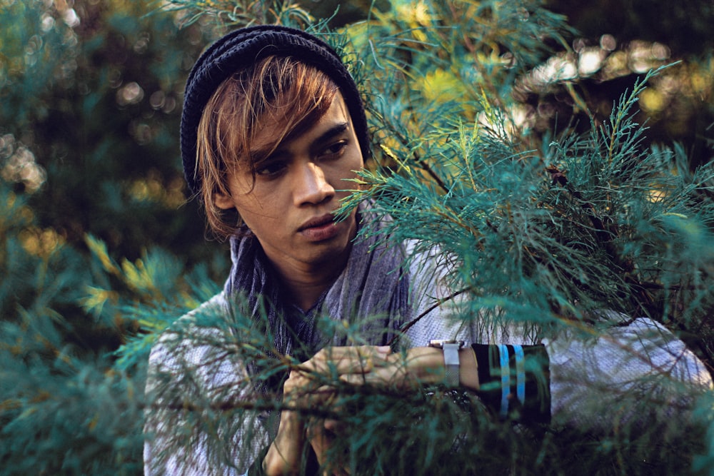 man standing near tree