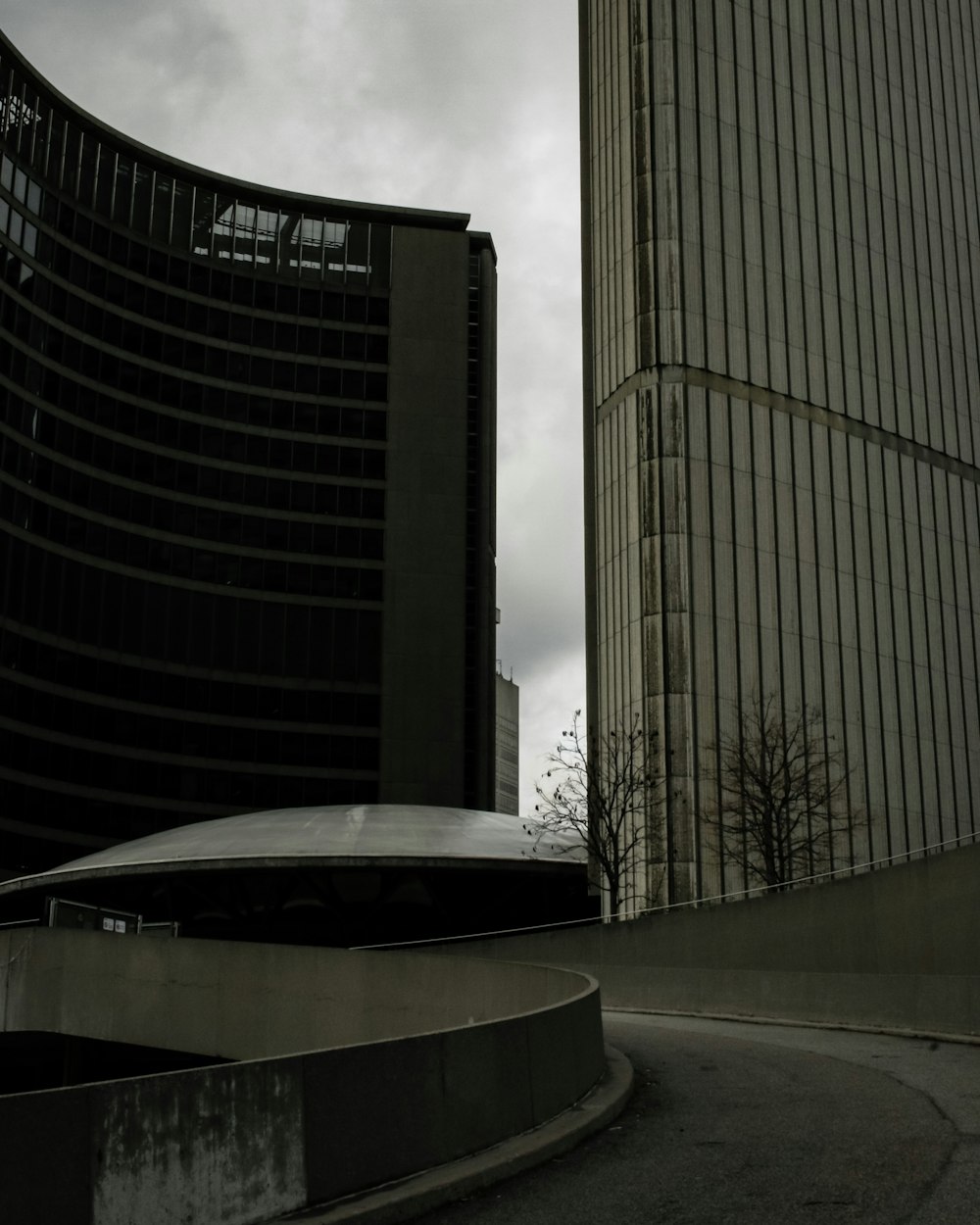 a car driving down a street next to tall buildings