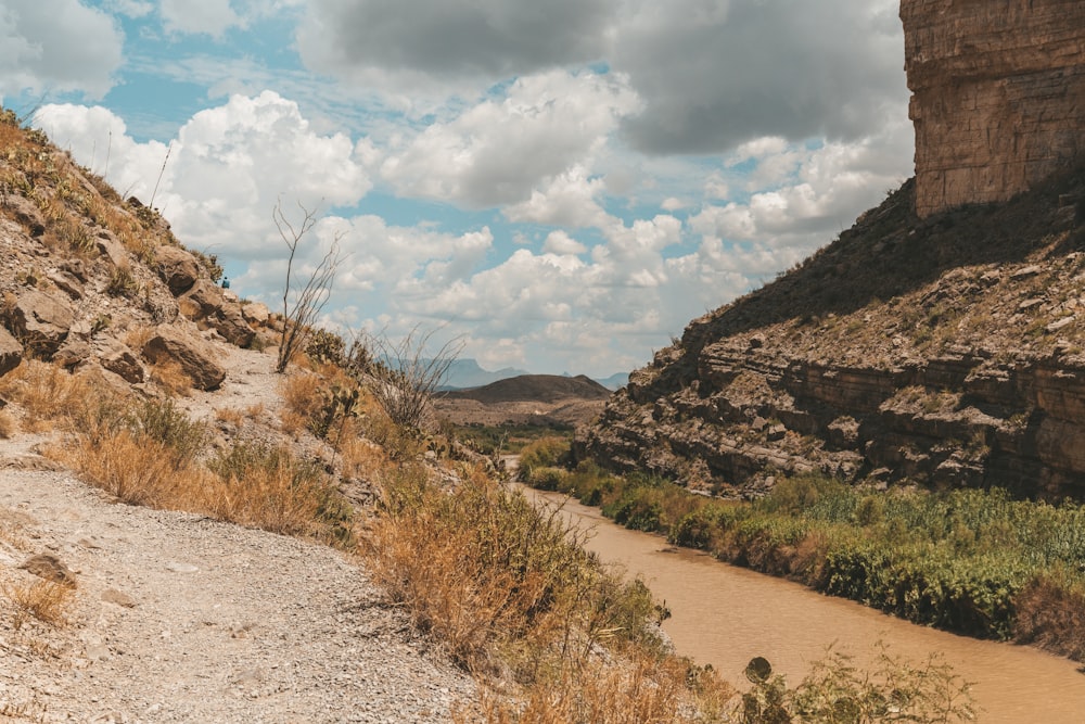 a dirt path in the middle of a rocky area