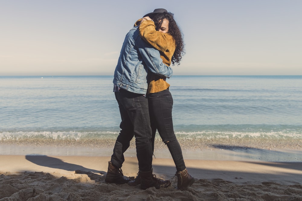 hugging man and woman on seashore