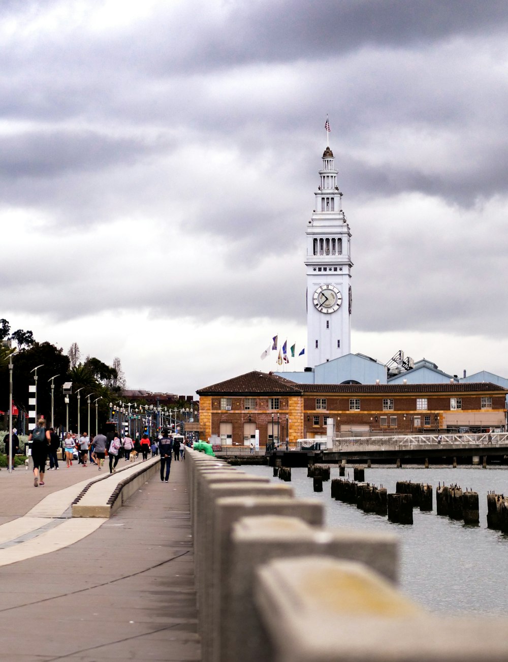 white clock tower on seashore