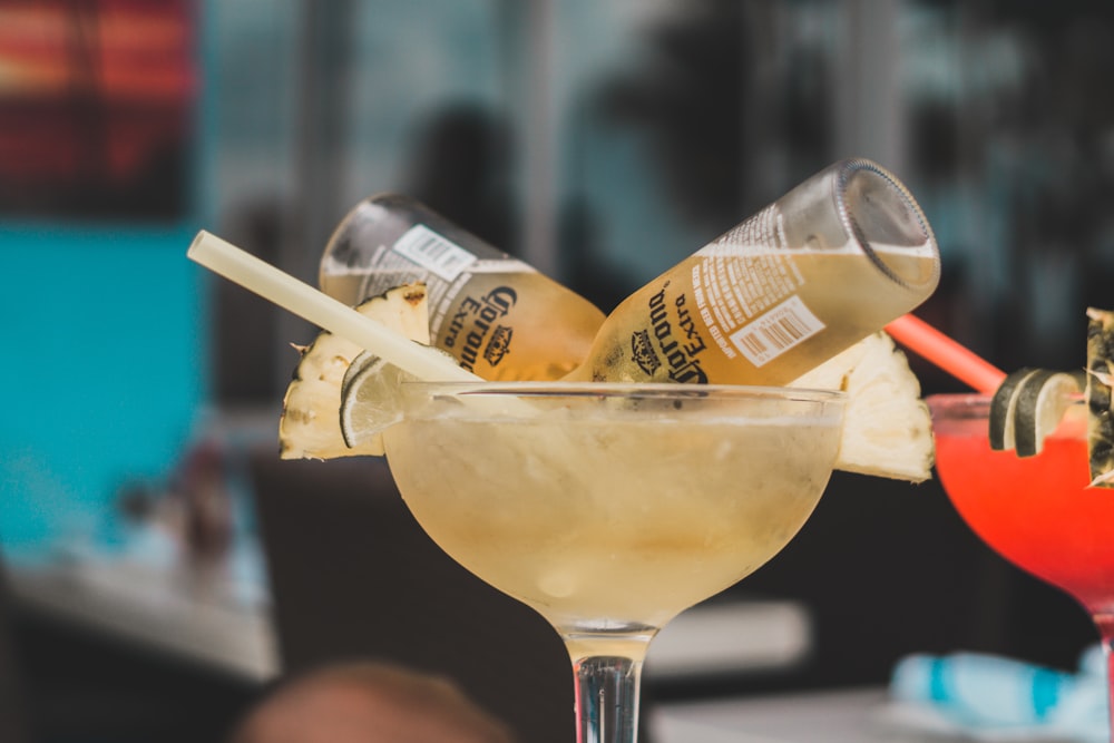 two Corona beer bottles on cocktail glass