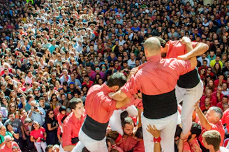 three men standing on crowd Catalonia