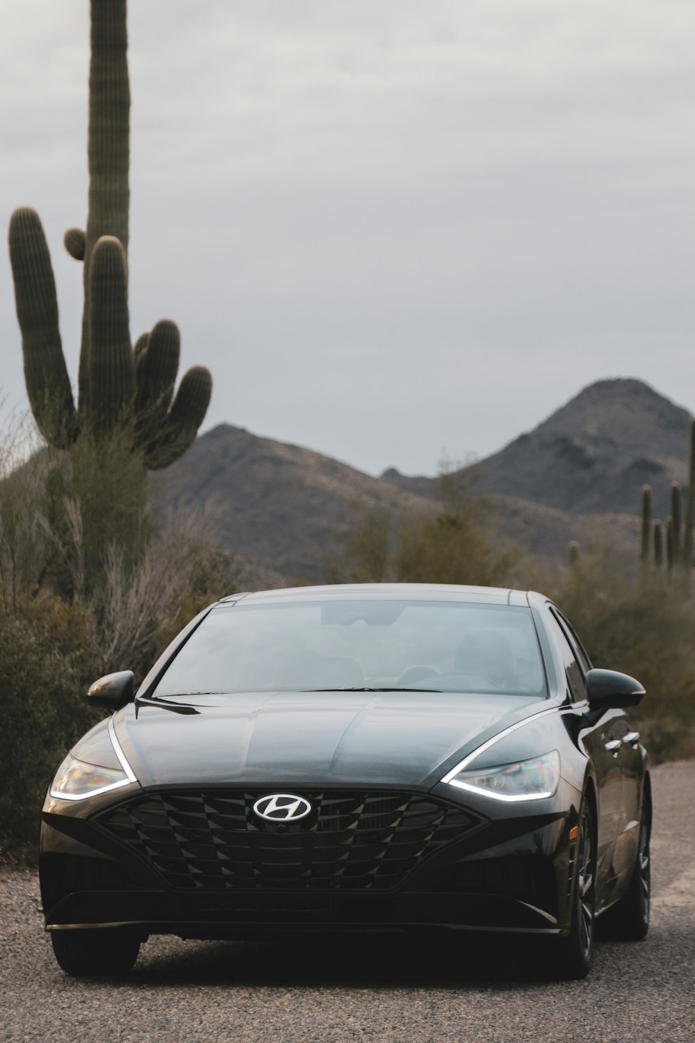 black Hyundai vehicle on road