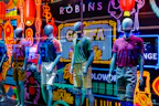 Trendy casual clothing displayed with vibrant background in store setting