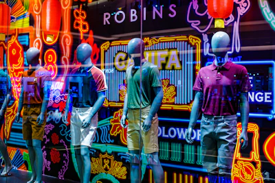 A vibrant display of trendy streetwear outfits on mannequins in a modern boutique setting.