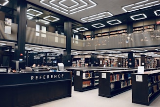 a library filled with lots of books and people