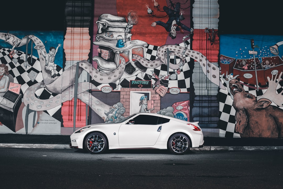 white coupe near graffiti