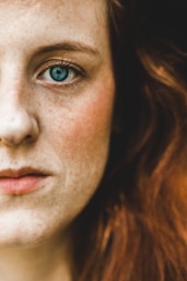 left cheek of green-eyed woman