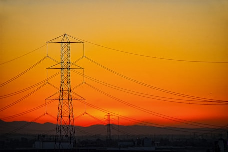 transmission towers during golden hour