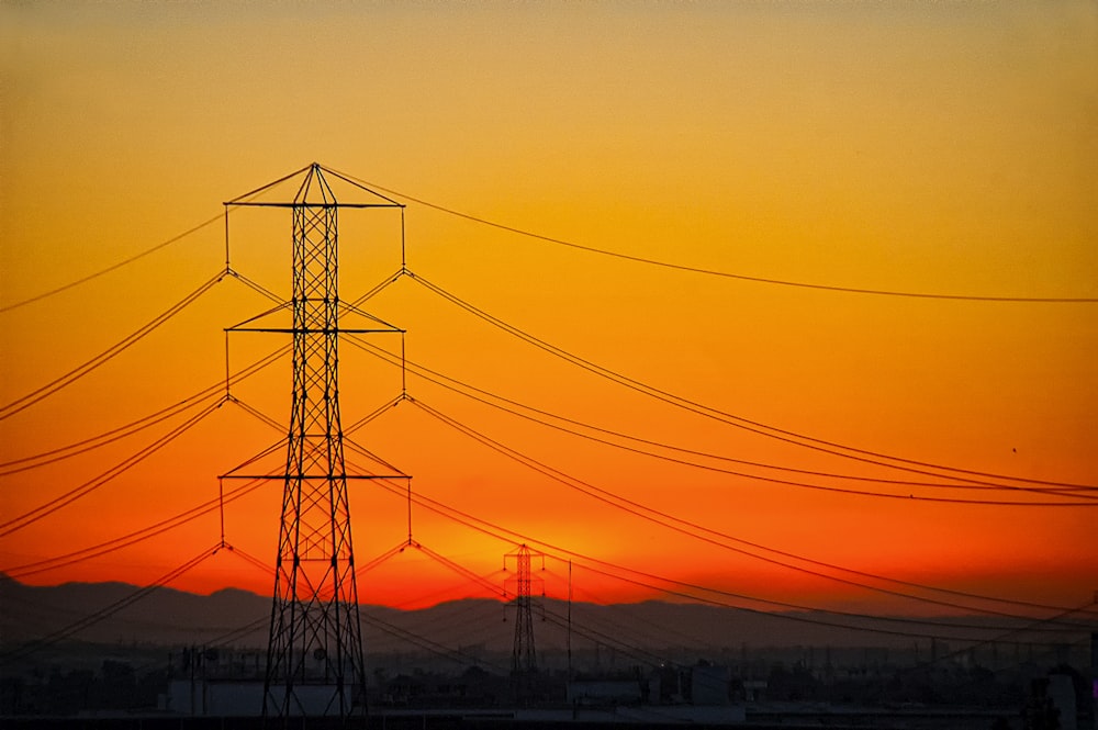 transmission towers during golden hour