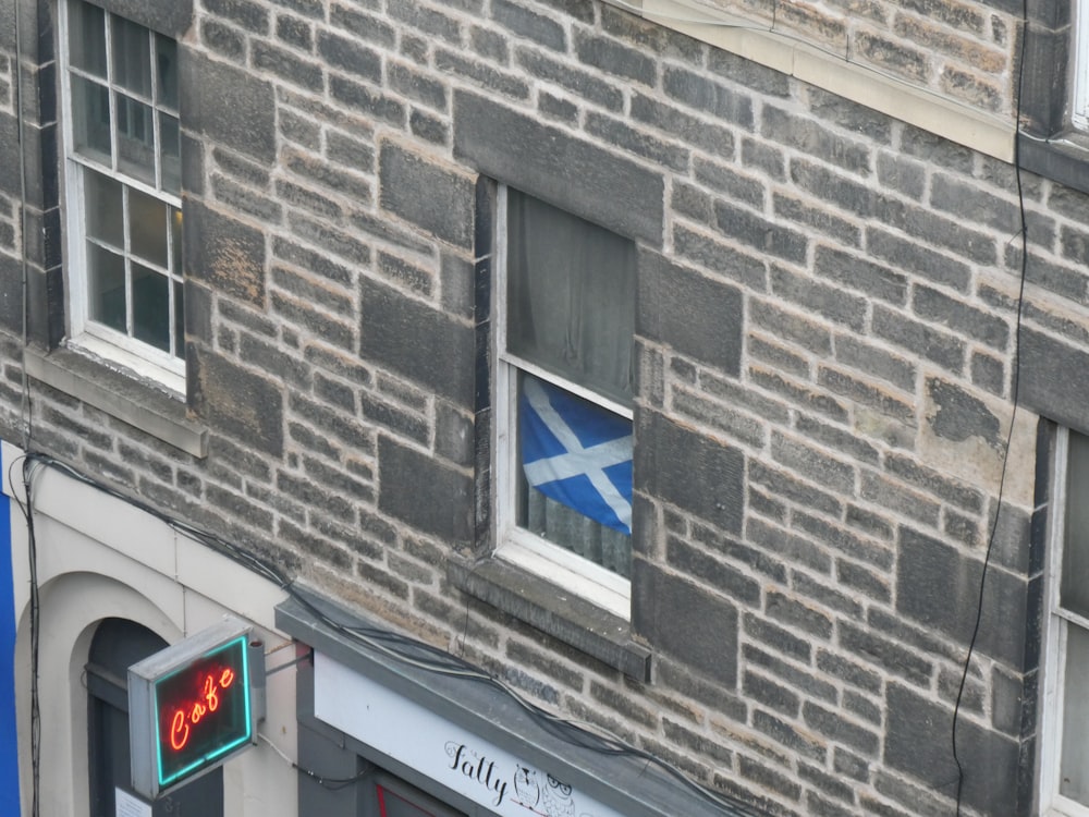 white and blue flag in the window