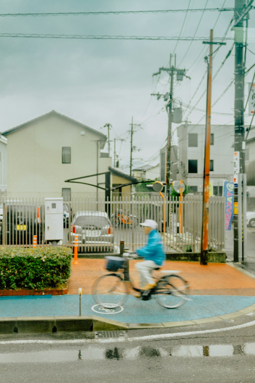 man cycling on sidewalk during daytime