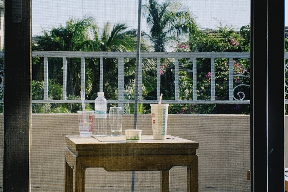 bottles on brown wooden table