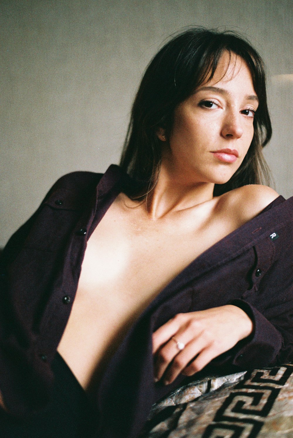 woman wearing brown button-up long-sleeved shirt