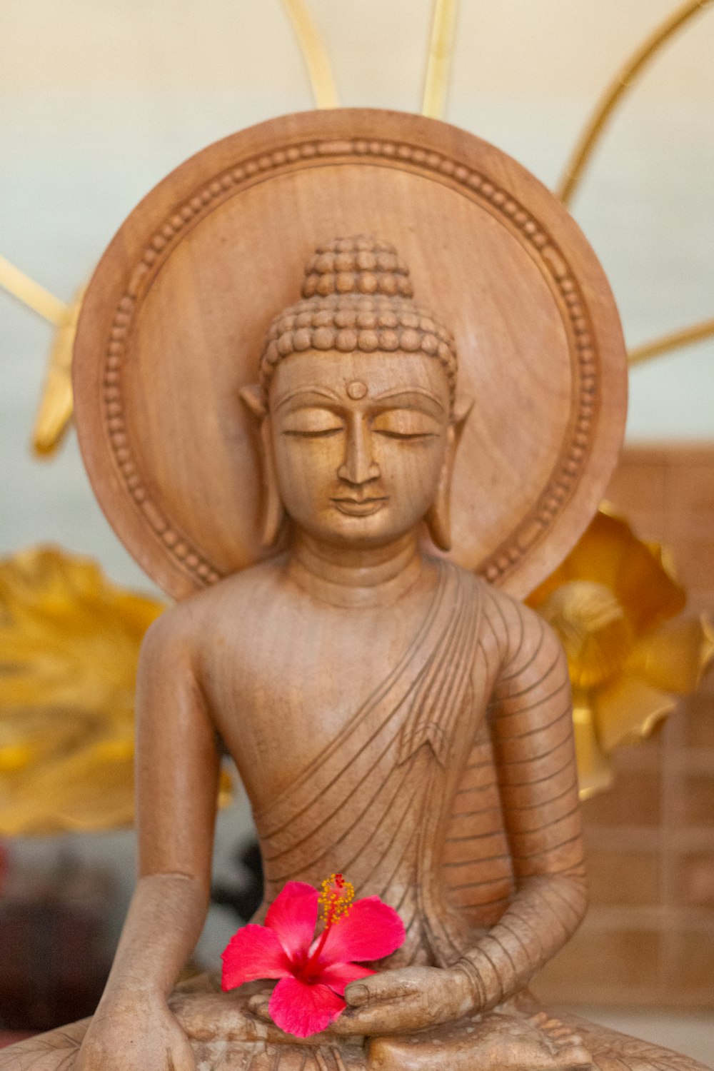 selective focus photography of Buddha with pink flower
