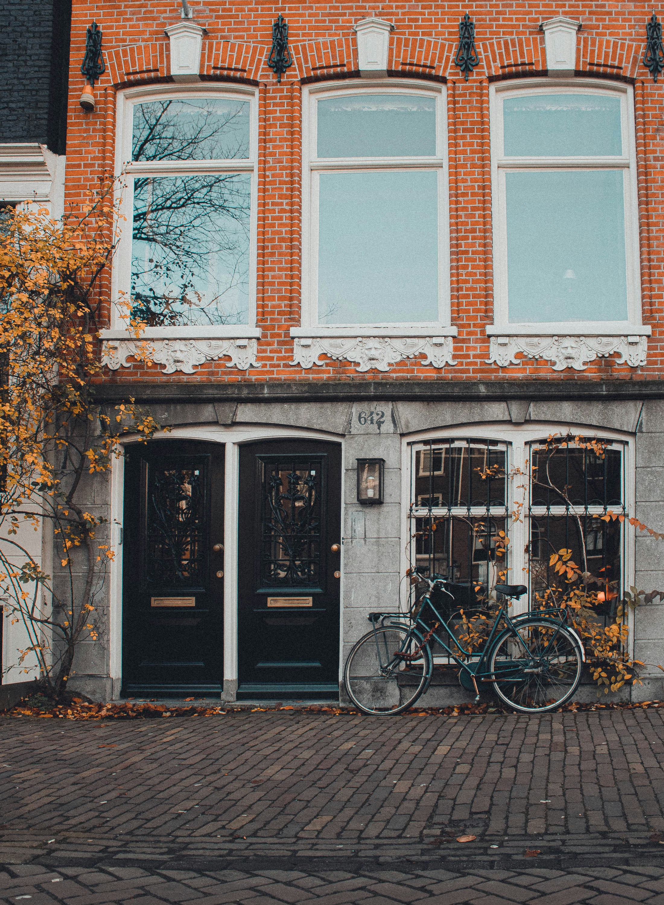 black bicycle parked on wall