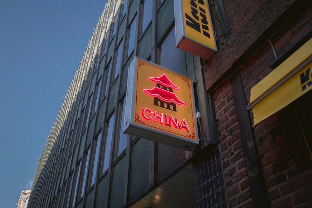 red and yellow China signage near building