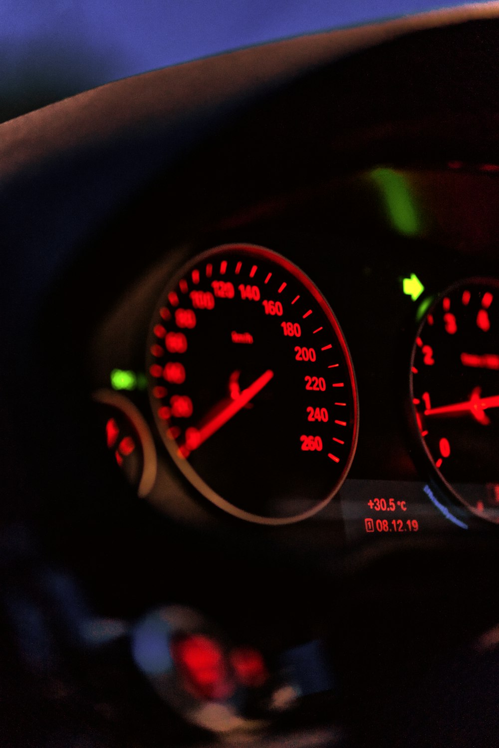 black vehicle speedometer