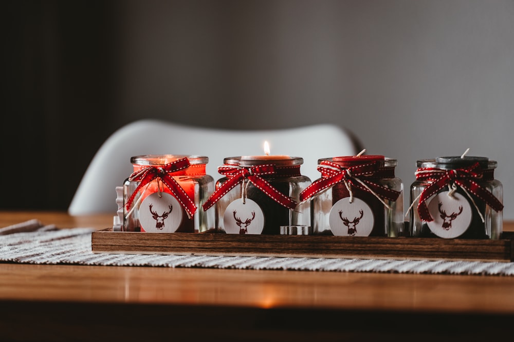 four clear glass jars