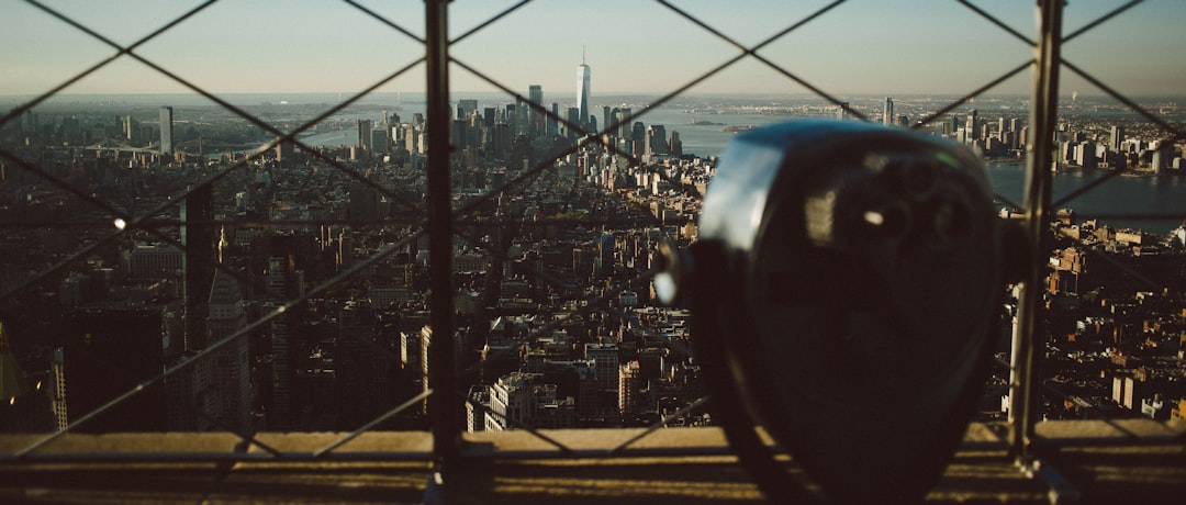 tower viewer facing fence with cityscape view