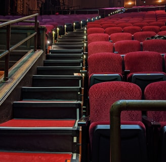 empty chairs inside a lighted hall