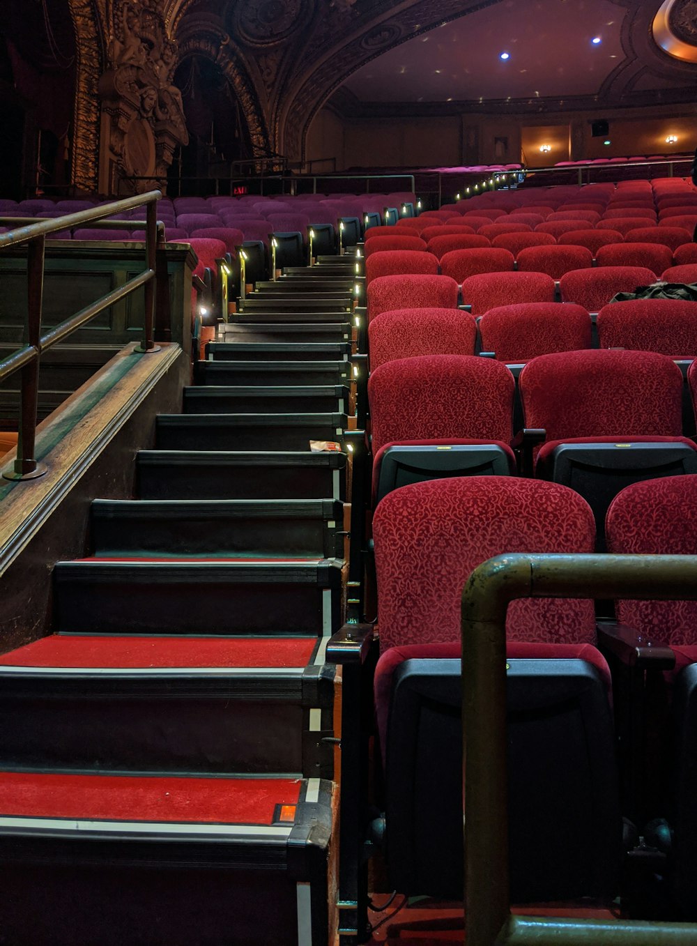 empty chairs inside a lighted hall