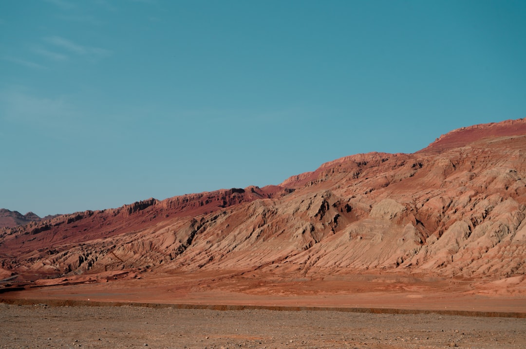 badland under blue sky