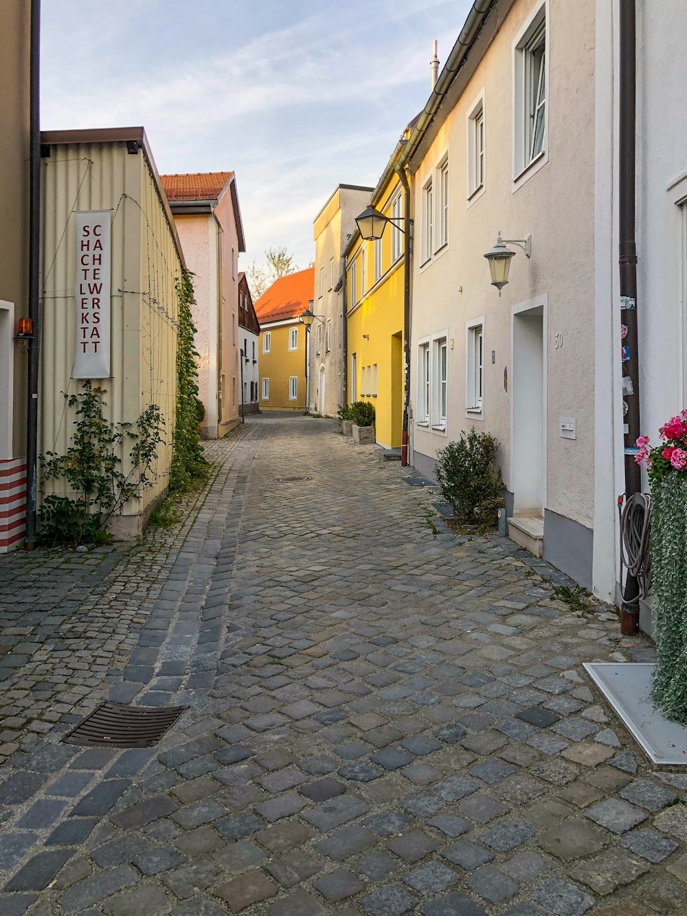 brick walkway between houses