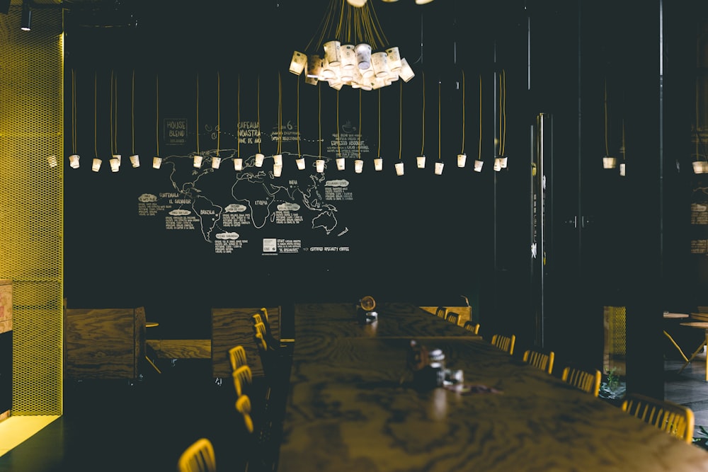 pedant lamp over wooden table and chairs