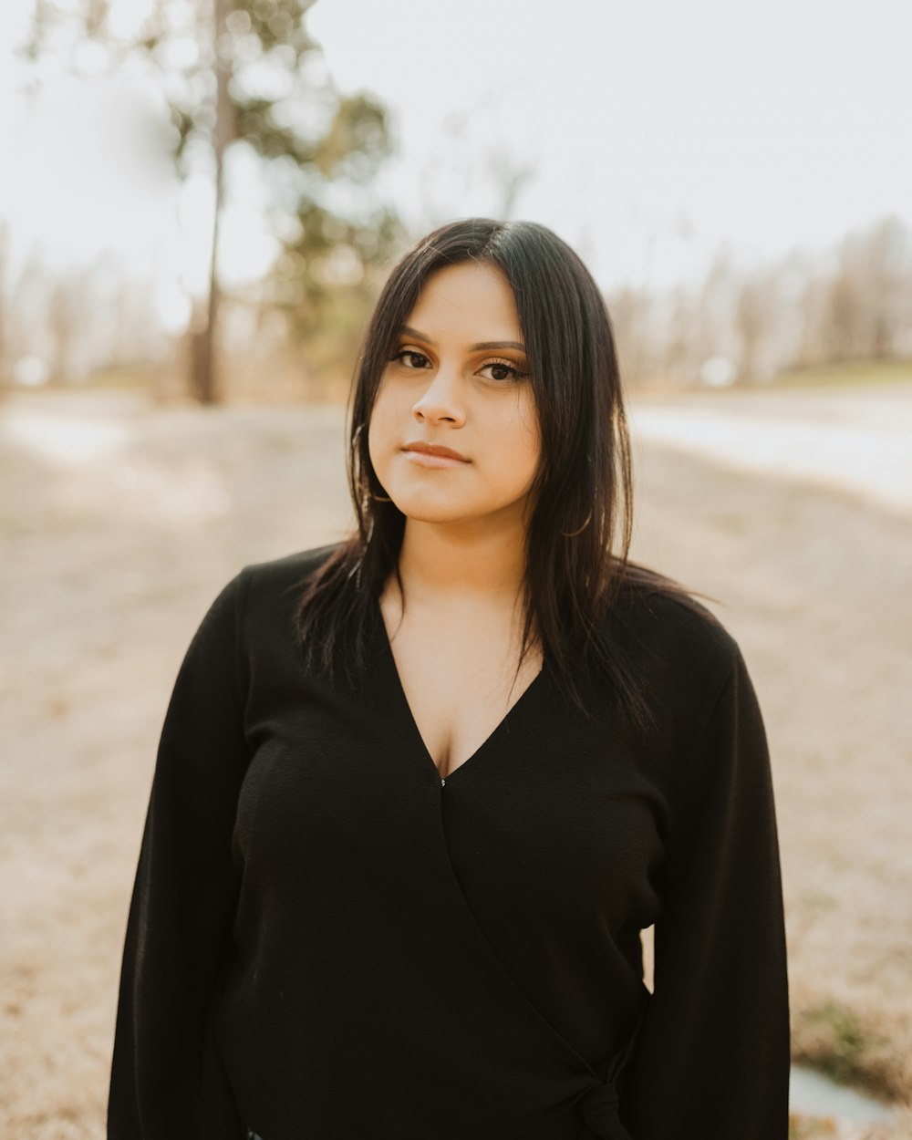 woman wearing black V-neck long-sleeved top