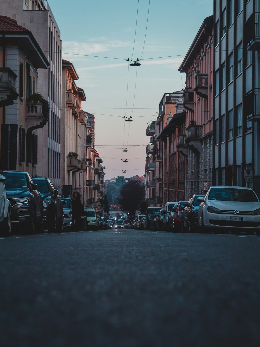 vehicles park beside buildings during daytime