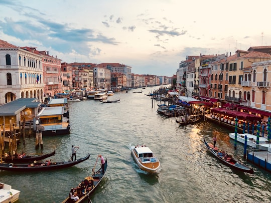 people riding on boats during daytime in Grand Canal Italy