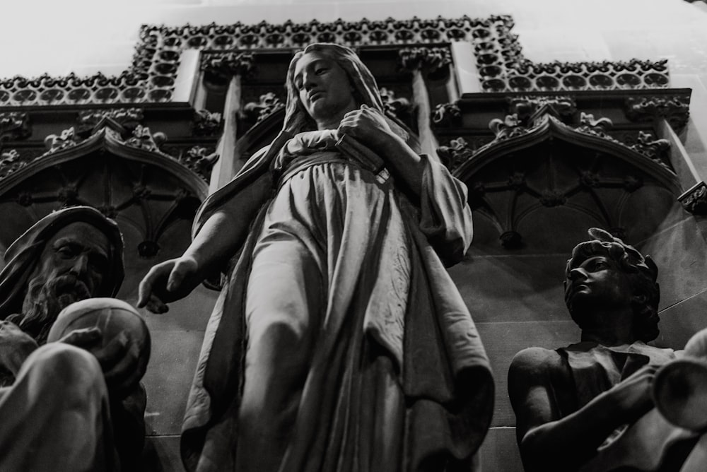 gray concrete statue of a woman