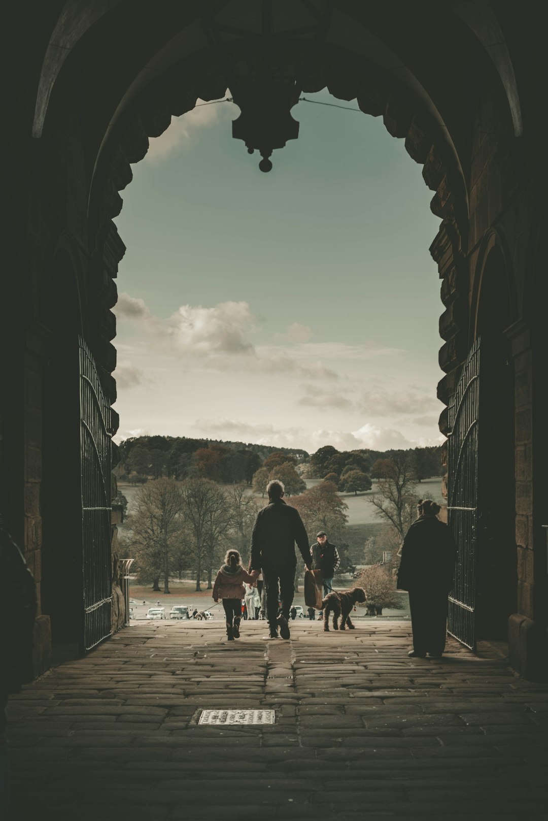 people walking on arch tunnel