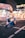 woman sitting beside 8 Town stall