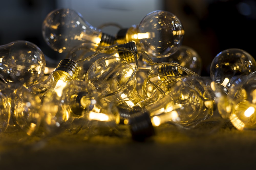 selective focus photography of clear light bulbs