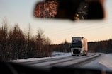 gray cargo truck on road during daytime