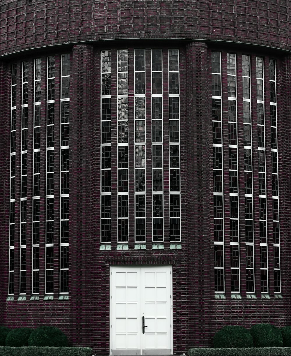 a large brick building with a white door